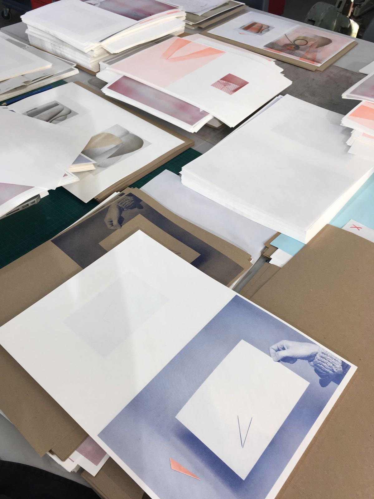stacks of prints ready to be assembled for publication